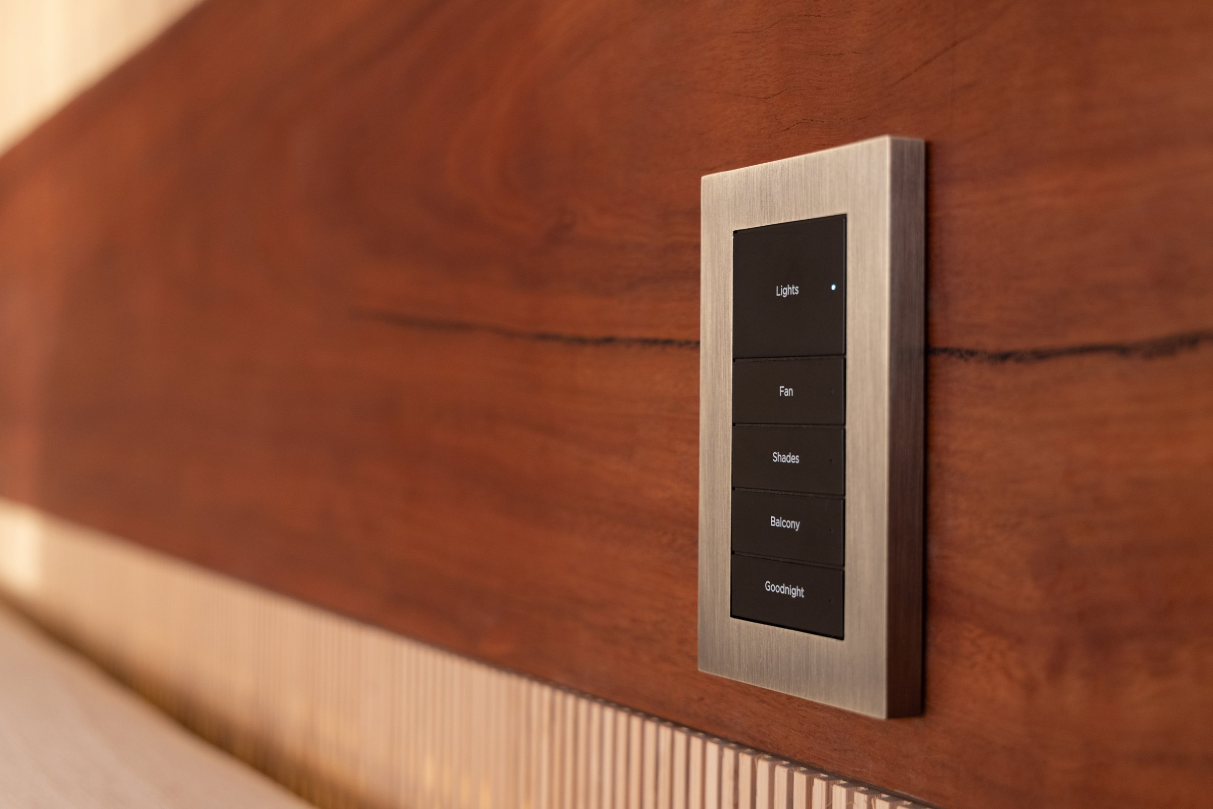 Lux keypad on a walnut wall