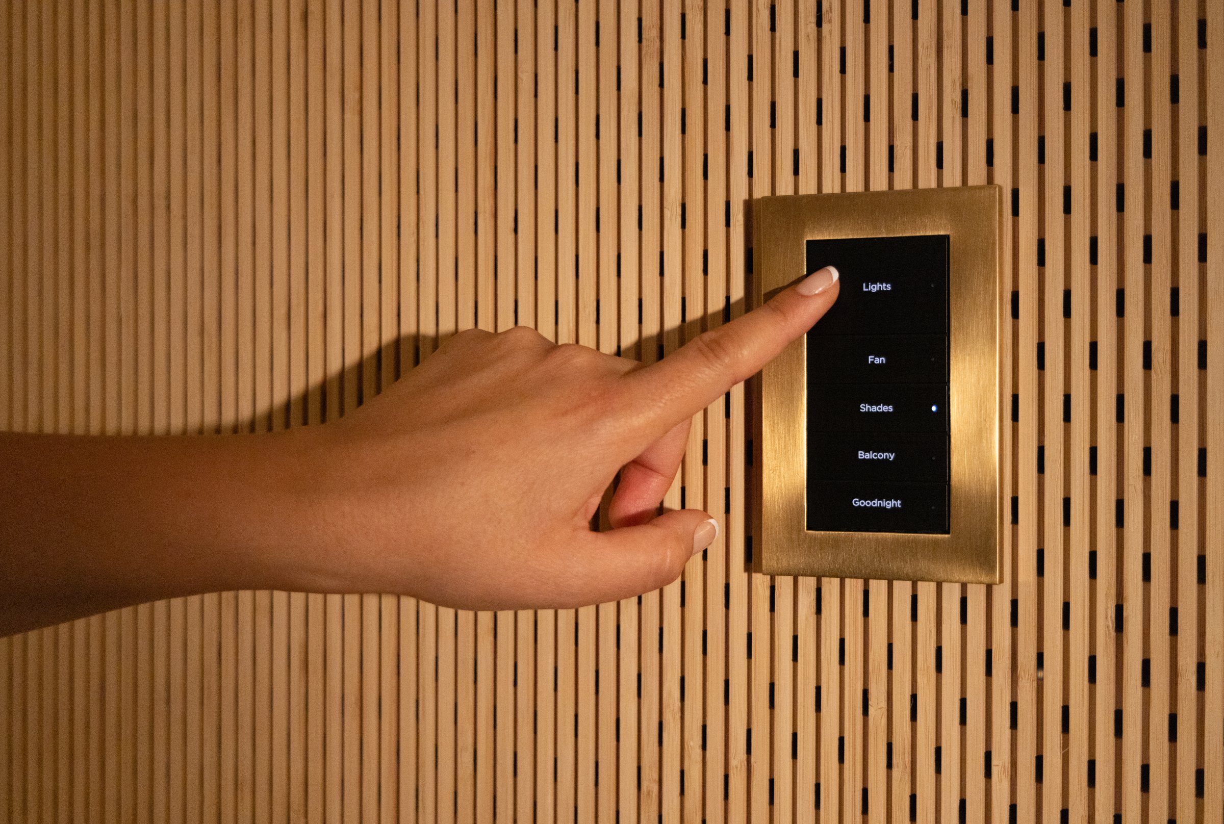 Hand pressing a Lux keypad